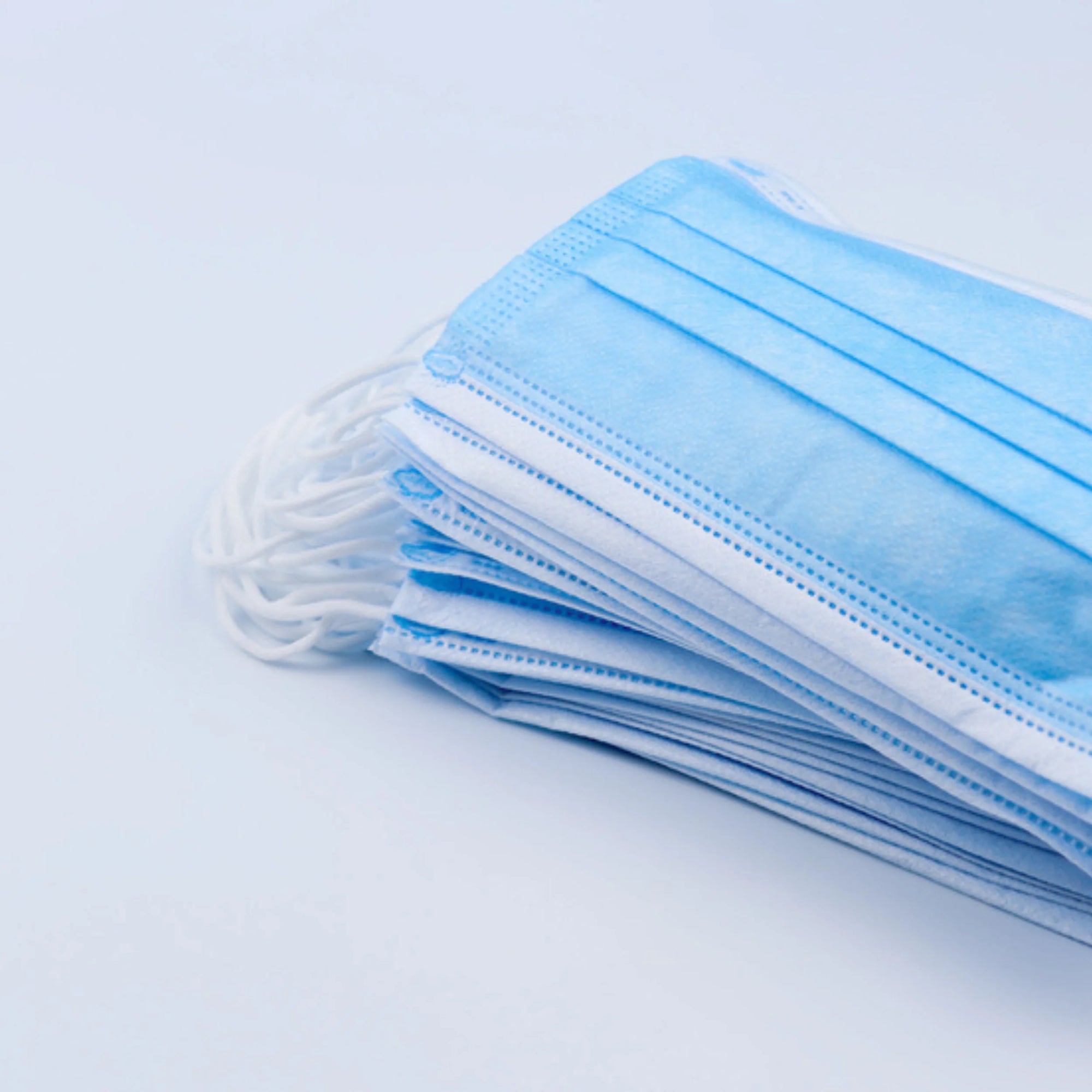 Pack of medical-grade face masks wholesale in blue with multiple layers for effective protection