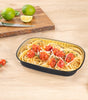 CE Disposables aluminum foil tray holding spaghetti with cherry tomatoes and herbs on a wooden surface