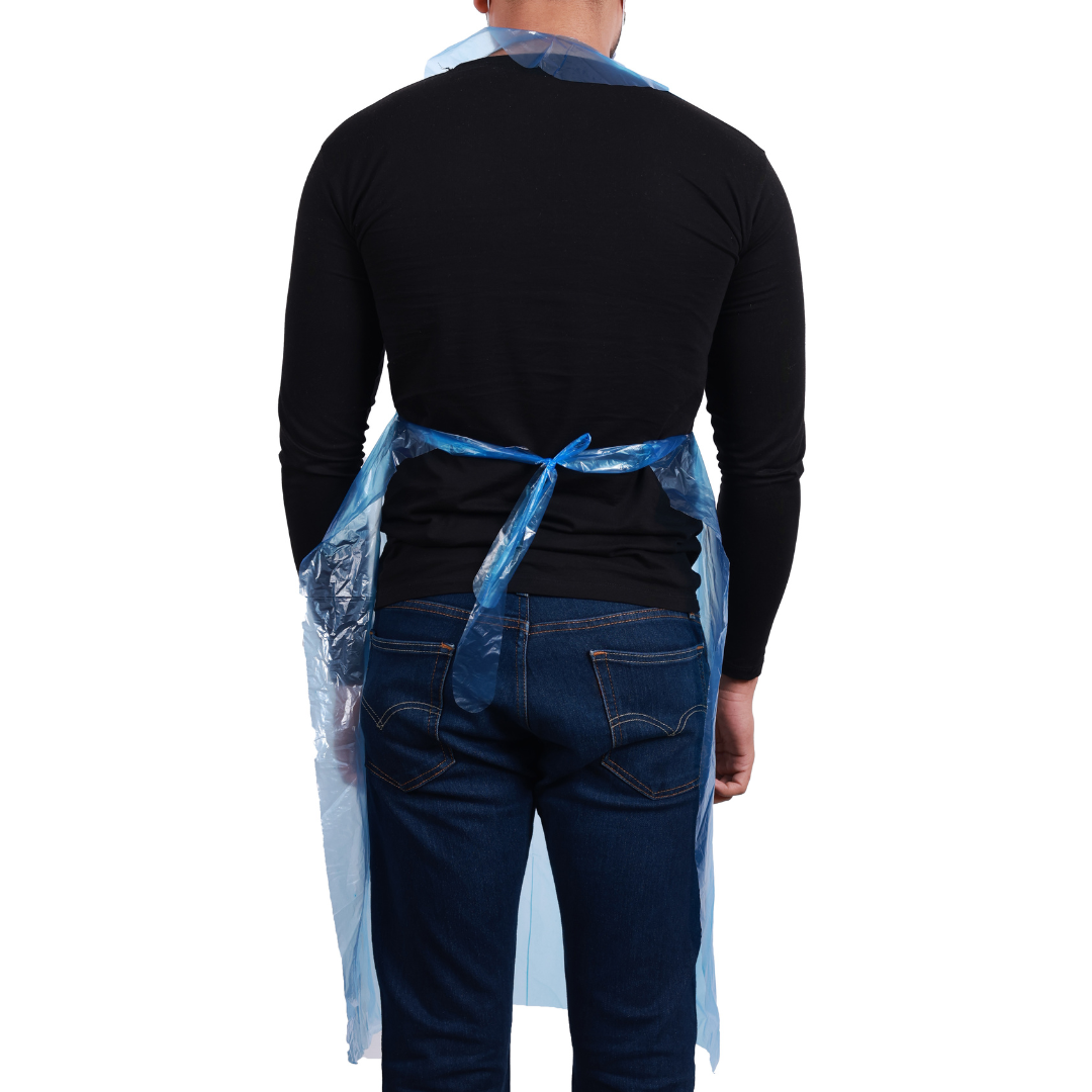Blue disposable aprons wholesale on a person, perfect for food service and messy tasks