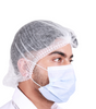 Man wearing a disposable hairnet with a blue mask, showcasing a disposable hairnet 1000 pack
