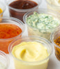 Variety of sauces in clear disposable portion cups condiment cup for serving sauces and dips