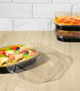 Clear plastic lids for trays by CE Disposables covering black food trays with salad and pasta